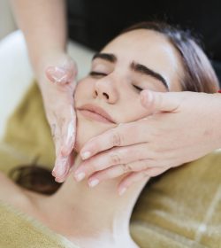Young woman receiving facial beauty treatment in a spa